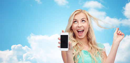 Image showing happy young woman or teenage girl with smartphone