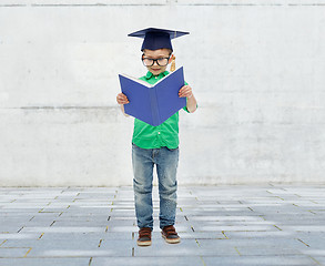 Image showing happy boy in bachelor hat and eyeglasses