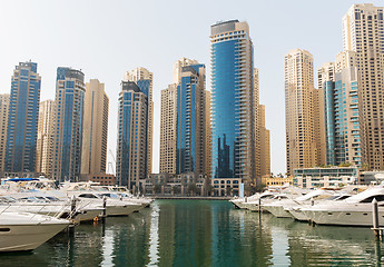 Image showing Dubai city seafront or harbor with boats