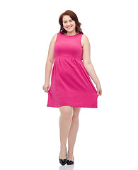 Image showing happy young plus size woman posing in pink dress