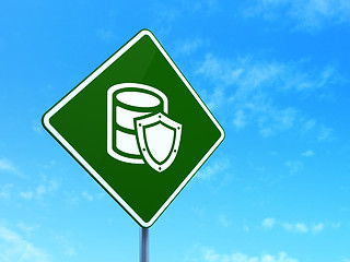 Image showing Programming concept: Database With Shield on road sign background