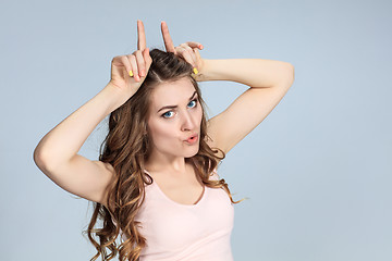 Image showing The young woman\'s portrait with happy emotions