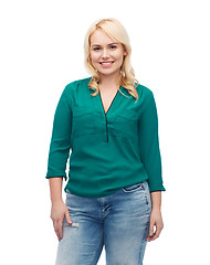 Image showing smiling young woman in shirt and jeans