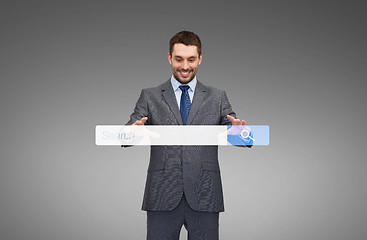 Image showing businessman working with internet search bar