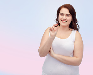 Image showing happy plus size woman in underwear with pill