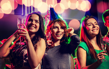 Image showing smiling friends with glasses of champagne in club