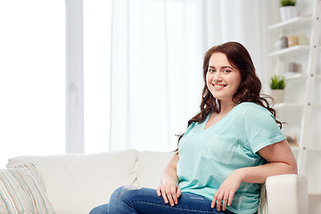 Image showing happy young plus size woman at home