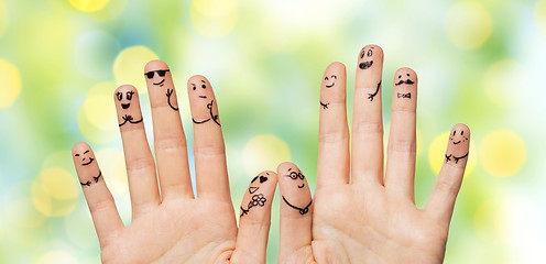 Image showing close up of hands and fingers with smiley faces