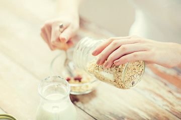 Image showing close up of woman eating muesli for breakfast