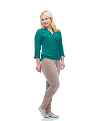 Image showing smiling young woman in shirt and trousers