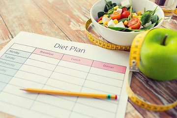 Image showing close up of diet plan and food on table