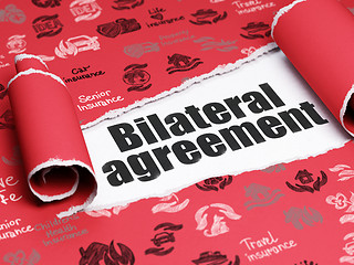 Image showing Insurance concept: black text Bilateral Agreement under the piece of  torn paper