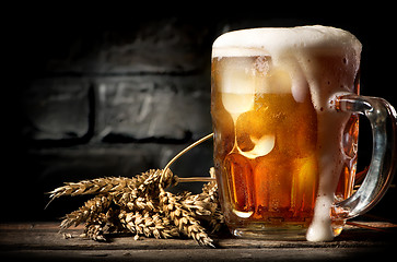 Image showing Beer near brick wall