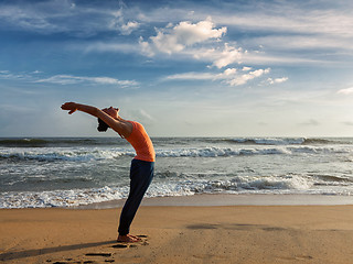 Image showing Woman doing yoga Sun salutation Surya Namaskar 