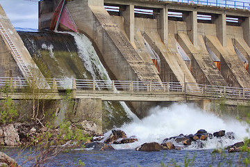 Image showing Powerful water discharge through gate of power plant