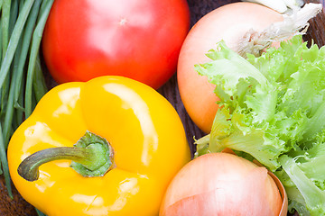 Image showing vegetables on a wooden background