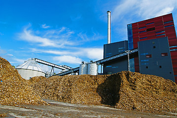 Image showing bio power plant with storage of wooden fuel (biomass) against bl