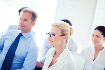 Image showing businessmen and businesswomen on conference