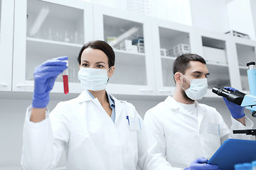 Image showing young scientists making test or research in lab