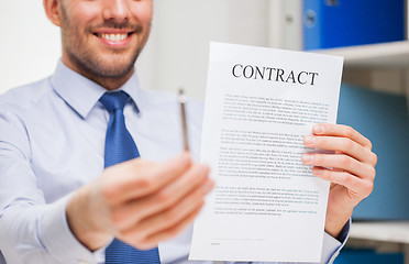 Image showing close up of businessman holding contract document