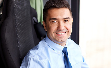 Image showing close up of happy bus driver or businessman