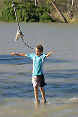 Image showing boy walking on water