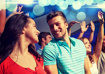 Image showing smiling friends at concert in club