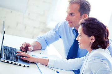 Image showing man and woman working with laptop in office