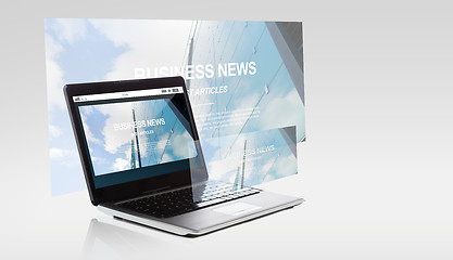 Image showing laptop computer with business news on screen
