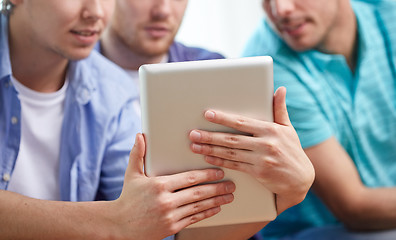 Image showing close up of happy friends with tablet pc at home