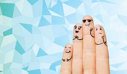 Image showing close up of four fingers family with smiley faces