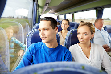 Image showing happy couple or passengers in travel bus