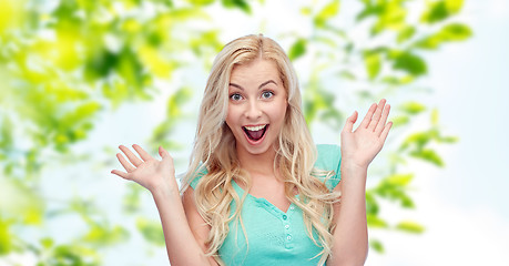 Image showing surprised smiling young woman or teenage girl