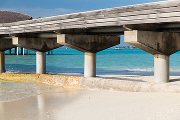 Image showing bridge on stilts at exotic resort beach