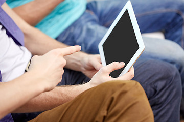 Image showing close up of male hands with tablet pc at home