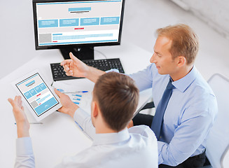 Image showing businessmen with web design on tablet pc computer