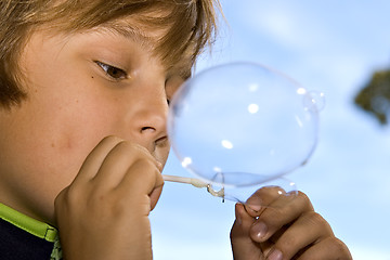 Image showing boy blowing bubbles