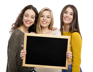 Image showing Teenage girls holding a chalkboard