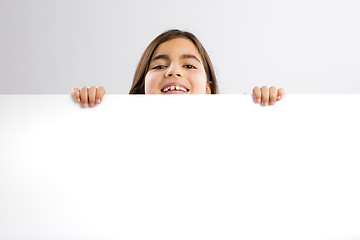 Image showing Girl holding a whiteboard