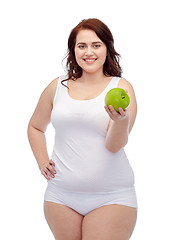 Image showing happy plus size woman in underwear with apple