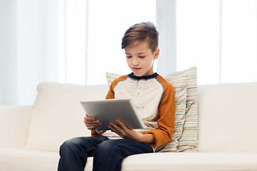 Image showing boy with tablet computer at home