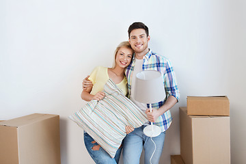 Image showing happy couple with stuff moving to new home