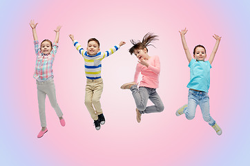 Image showing happy little children jumping in air