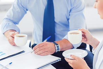 Image showing man and woman discussing something in office