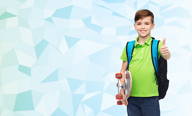 Image showing boy with backpack and skateboard showing thumbs up