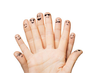 Image showing close up of hands and fingers with smiley faces