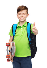 Image showing boy with backpack and skateboard showing thumbs up