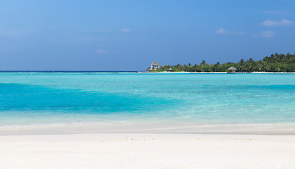 Image showing maldives island beach with palm tree and villa