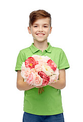 Image showing happy boy holding flower bunch