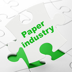 Image showing Manufacuring concept: Paper Industry on puzzle background